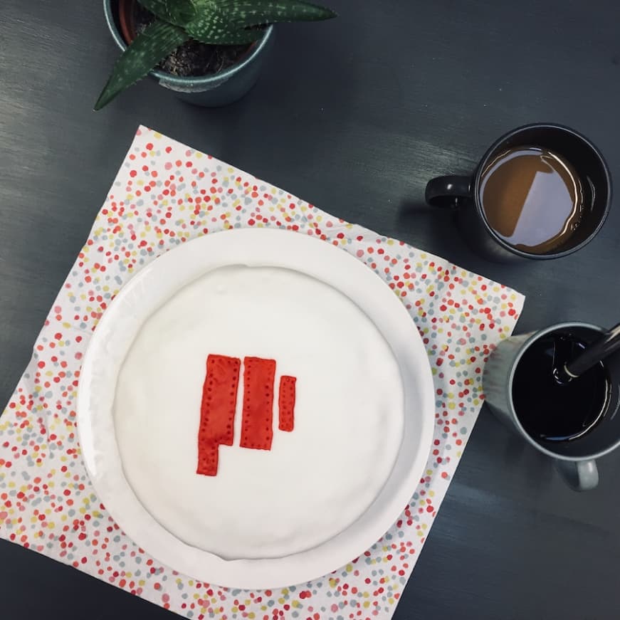 A cake with the Propeller Exmouth logo on it.