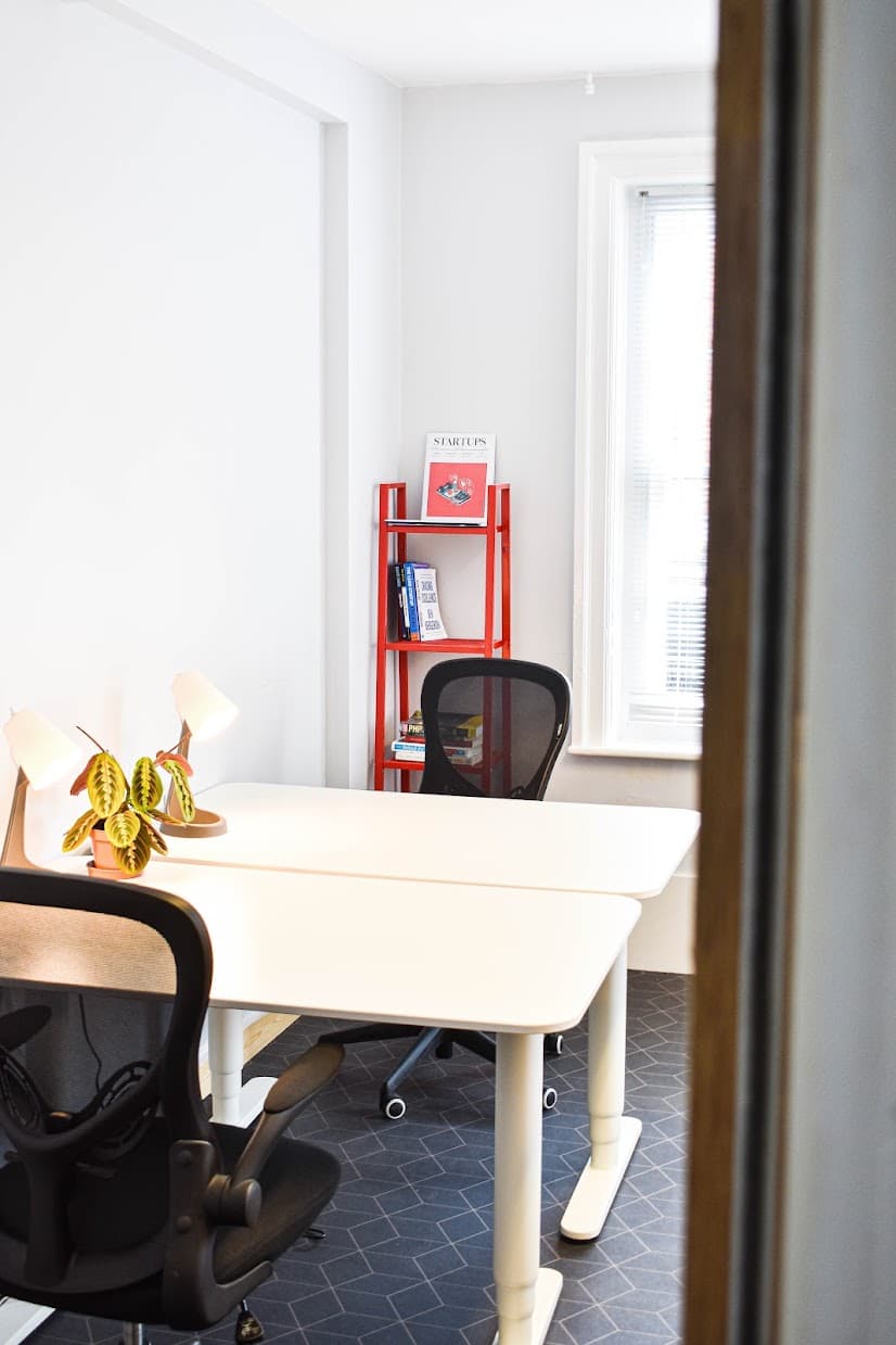Two desks with chairs and desk lamps at Propeller Exmouth